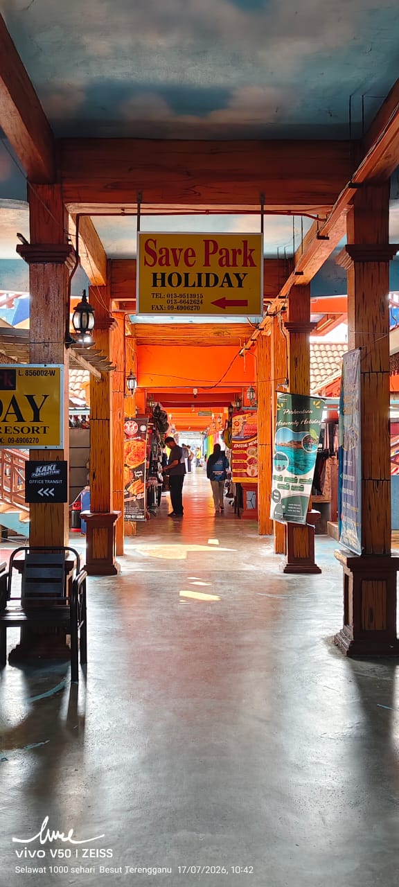 Save Park Holiday hanging sign inside the terminal walkway