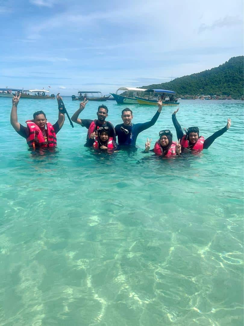 Snorkeler exploring a coral reef in the Perhentian Marine Park