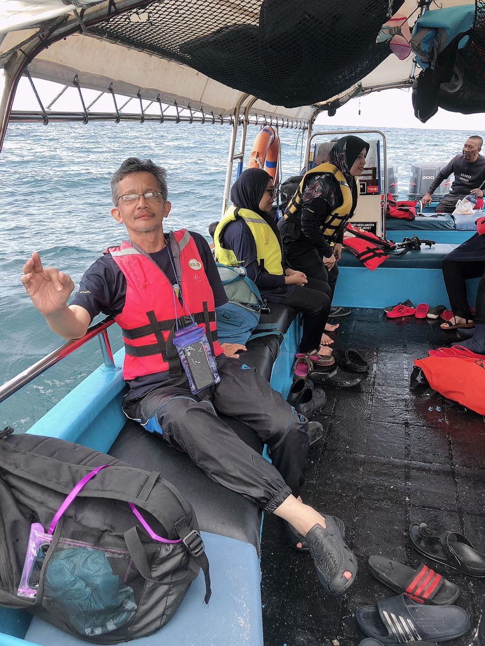 Passengers in life jackets on the snorkeling boat